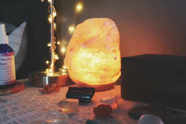 Using a salt lamp in sacred space to create a soft glow 